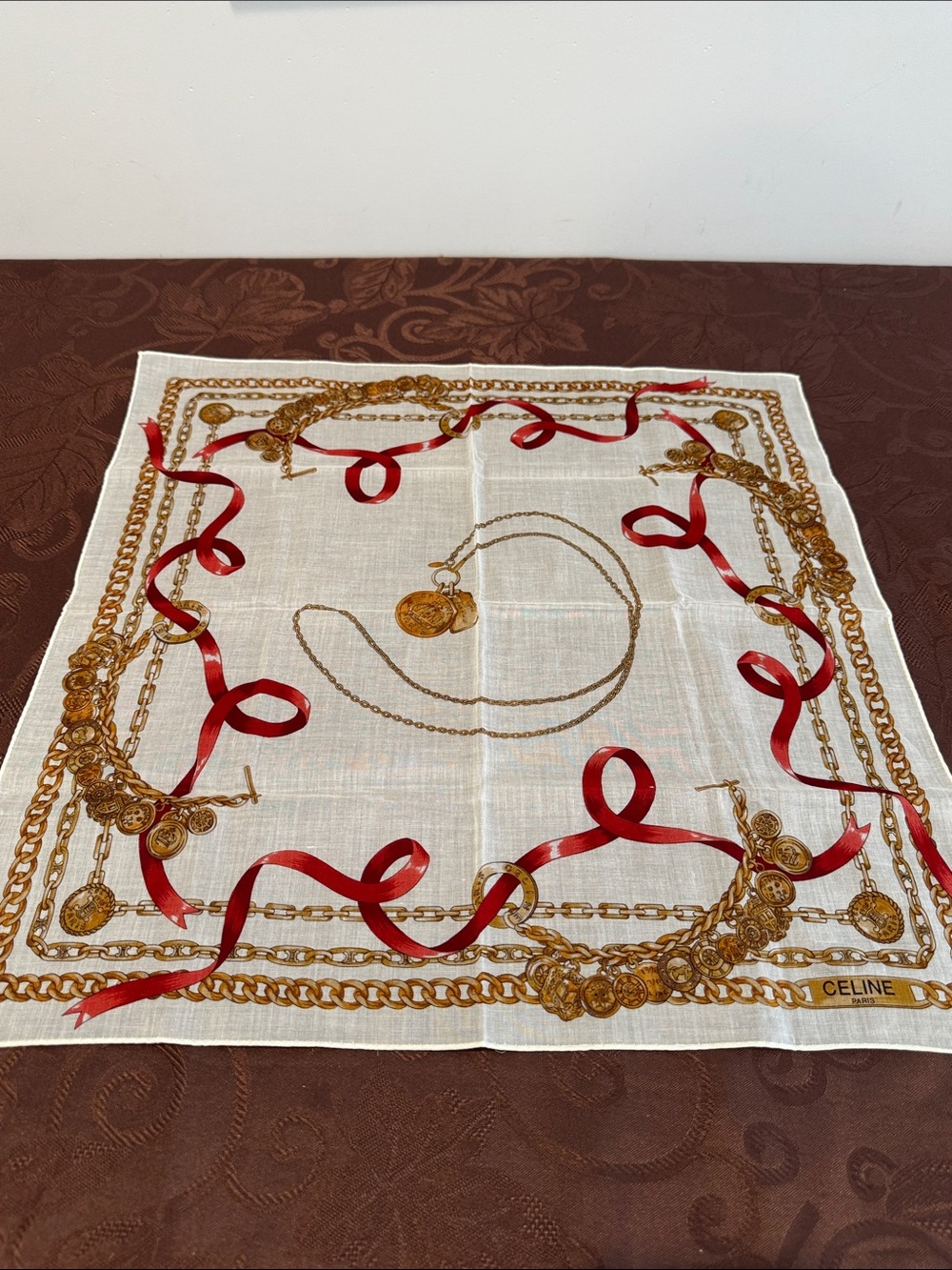 Celine Cream handkerchief with Red Ribbon and Gold Chain Print.